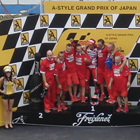 Casey and crew on podium at Motegi