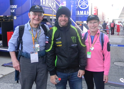 Cal Crutchlow with "Cal Experience" customers in paddock