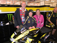Cal Crutchlow in his pit with customers