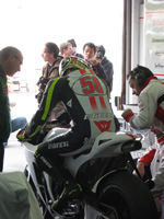 Marco Simoncelli in the pits at a motoGP test